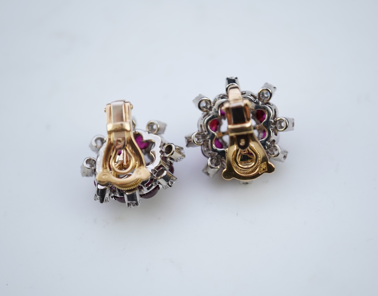 A pair of ruby and diamond ear clips, mid 20th century